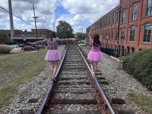 Kent McCown Group in tutus supporting the tutu project.