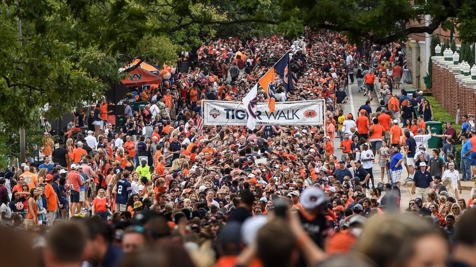 living in auburn, albama is the best when Auburn Football Fans gather to greet the players walking to the stadium for the football game