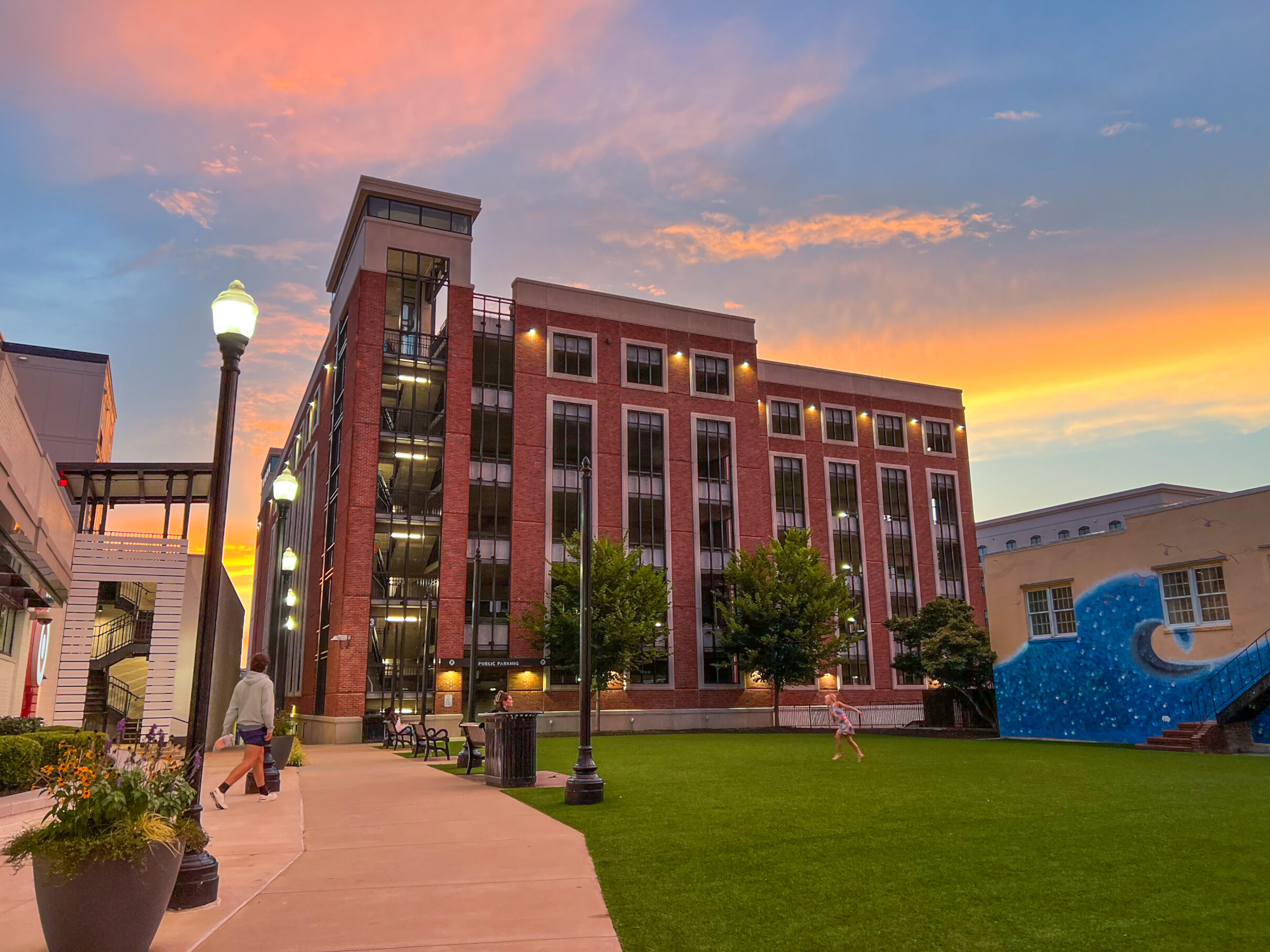 People enjoying green space on one of auburn's downtown areas. living in auburn, alabama is truly special