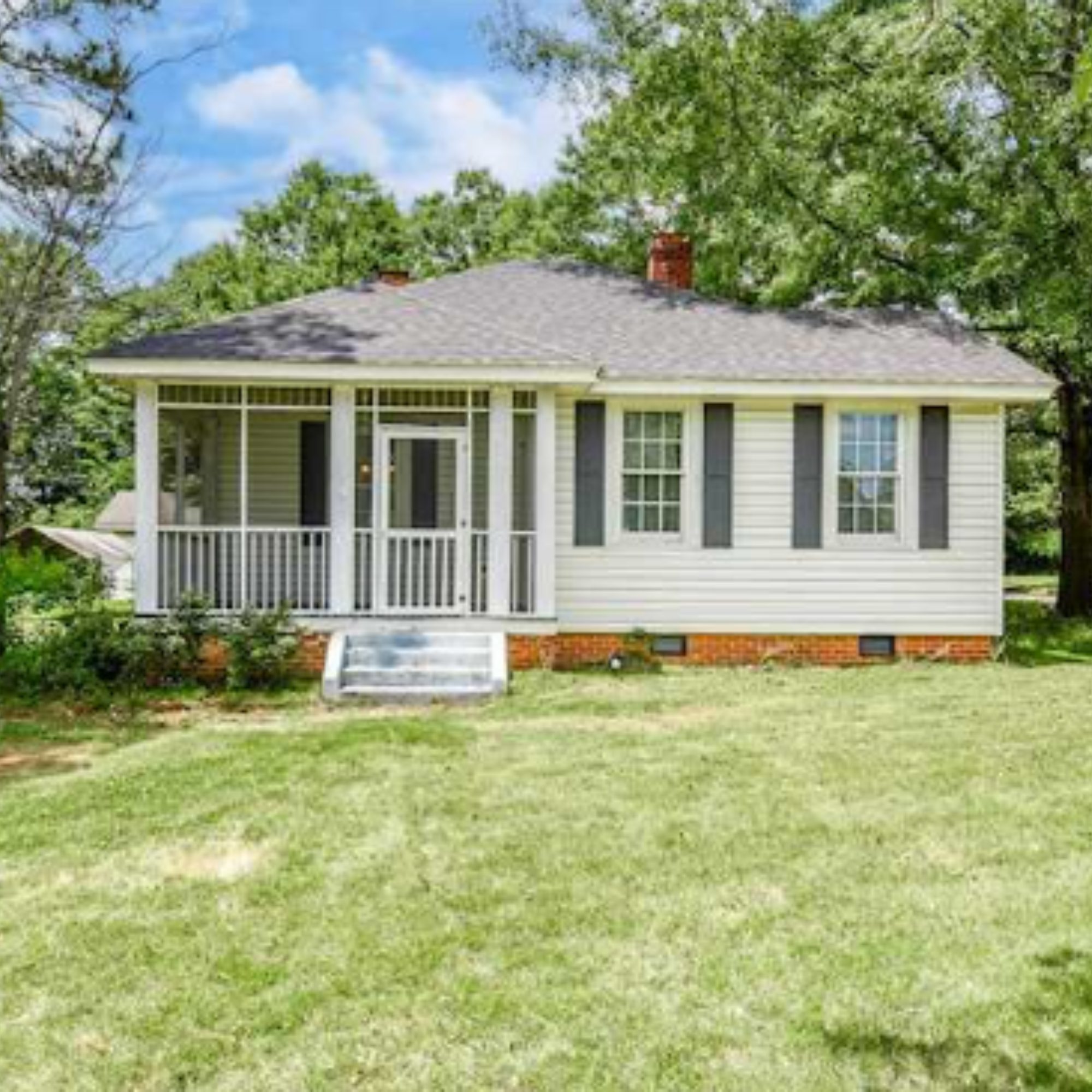 home in pepperell village Opelika Alabama featuring classic architecture, covered porch, and walkable neighborhood setting
