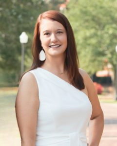 Corrie Kent Green, Auburn Alabama real estate agent with Kent McCown Group, Coldwell Banker Kennon Parker Alliance, professional outdoor headshot