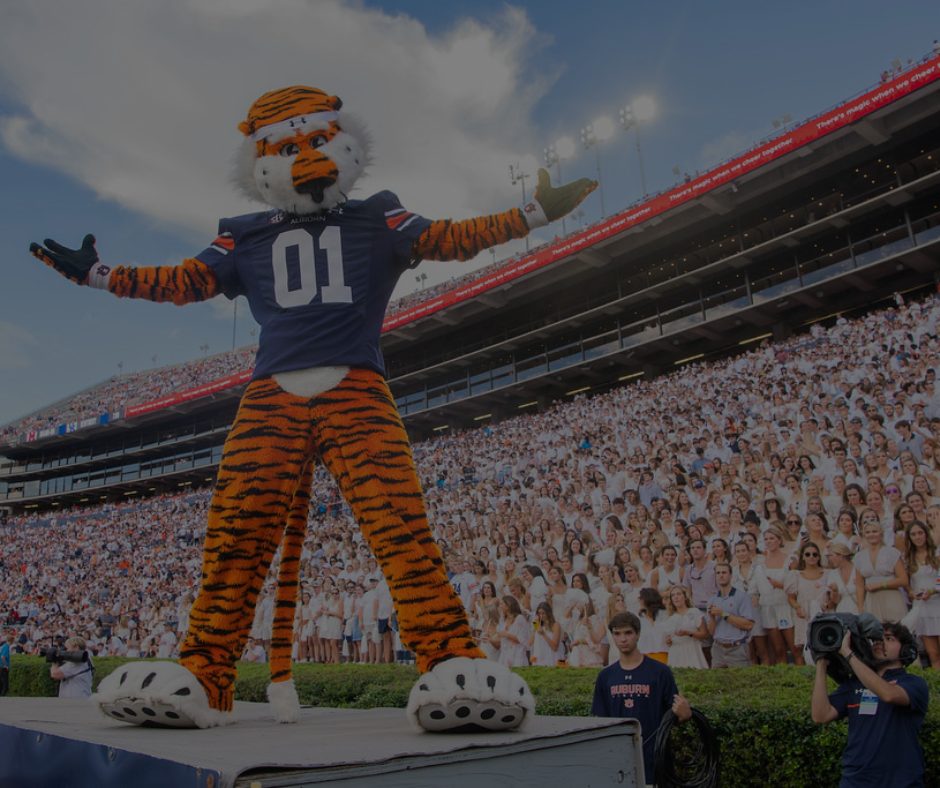 Auburn University student walking near Auburn condos close to campus