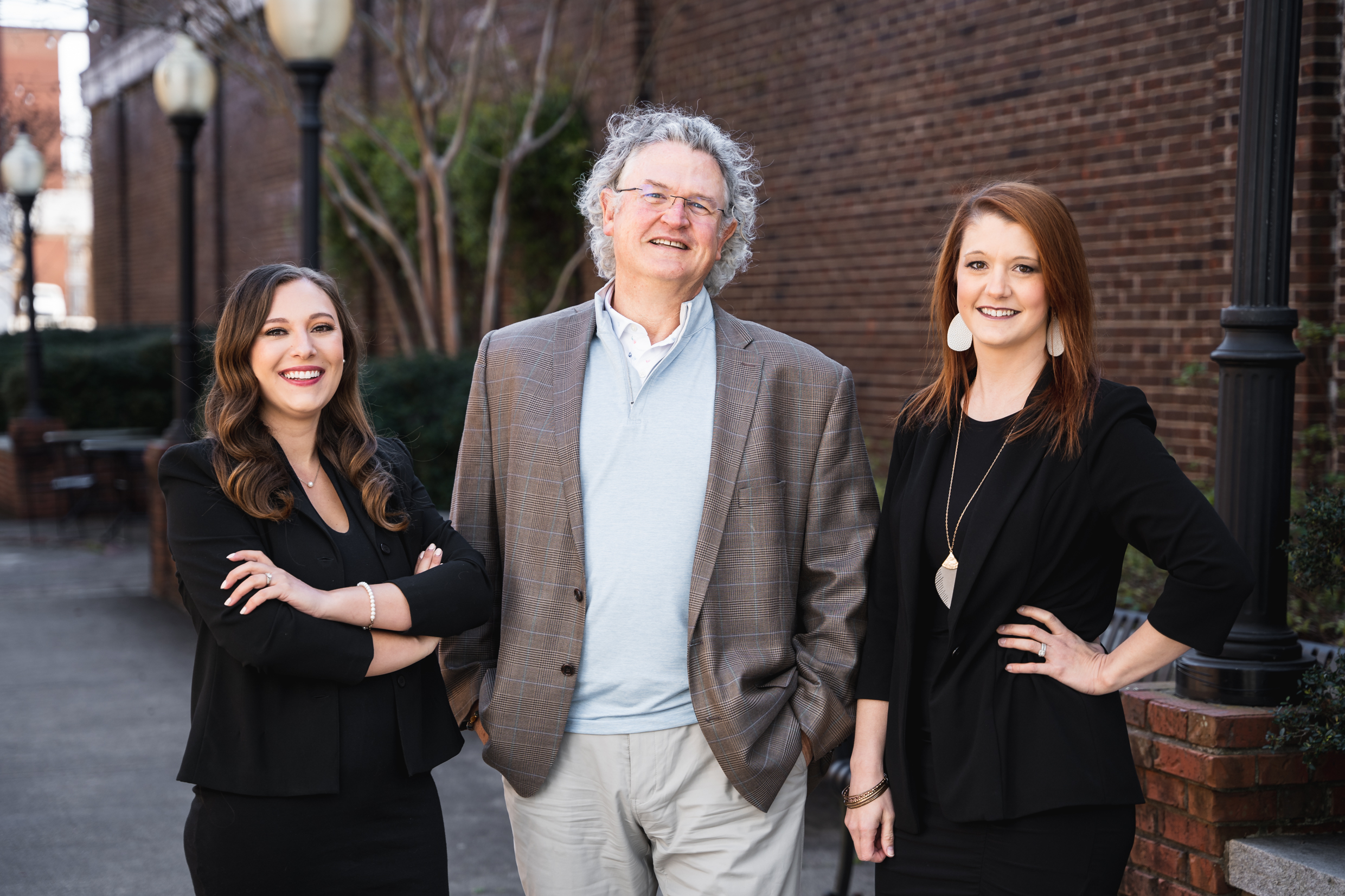 Kent McCown Group team photo featuring founder Corrie Kent Green, Bill McCown, and partner Megan Wysopal serving the Auburn and Opelika Alabama real estate community