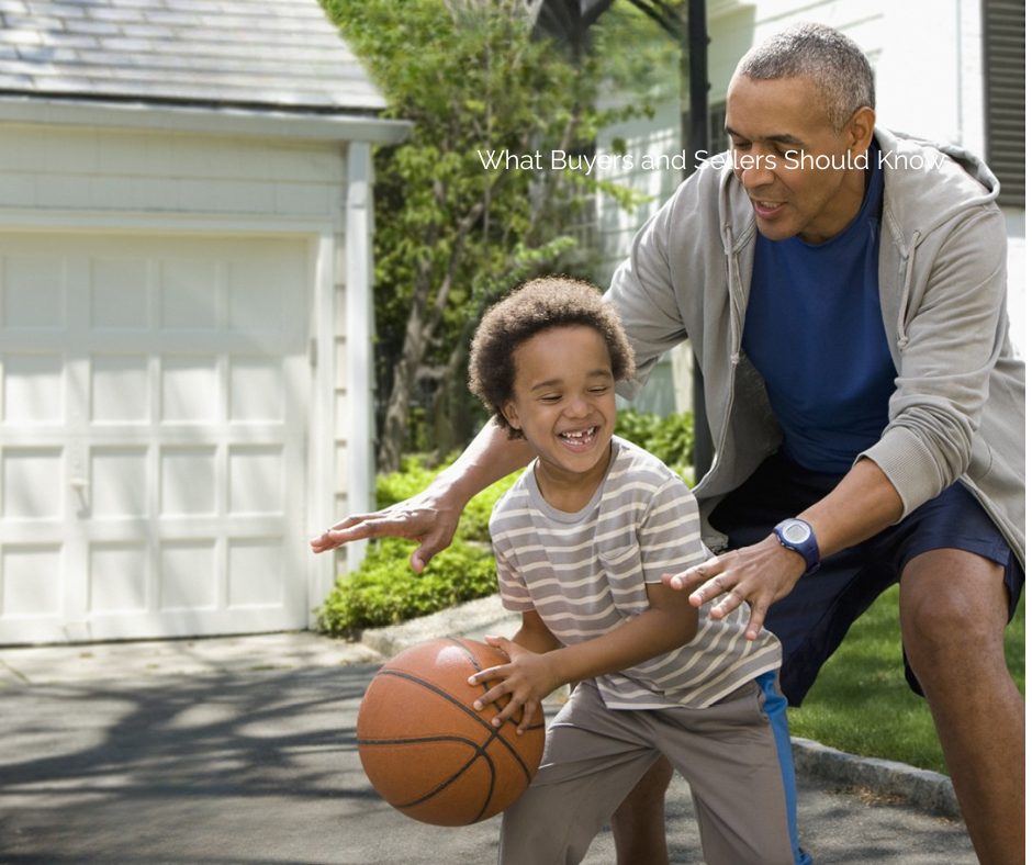 Family playing basketball in driveway of Auburn Alabama home, representing preparing to move before summer
