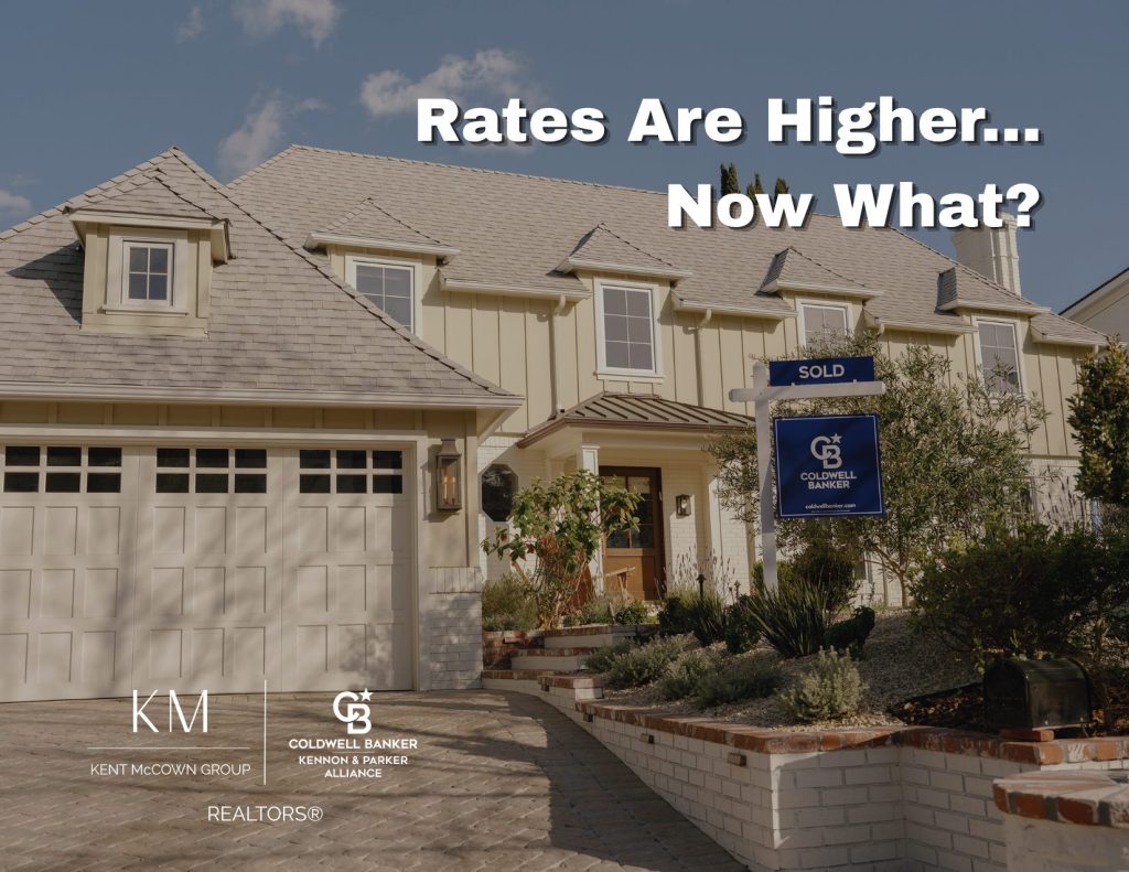 Home with a sold sign in the yard representing how rising interest rates impact buyers and sellers in today’s real estate market.