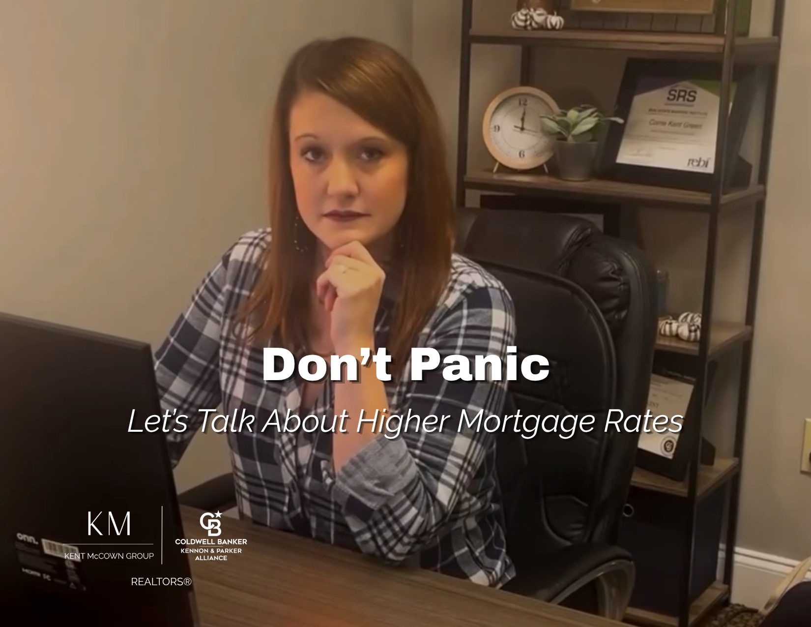 Real estate agent Corrie Green sitting at her desk with the headline "Don't Panic: Understanding Higher Mortgage Rates," introducing an educational blog about how rising mortgage rates affect home buyers.